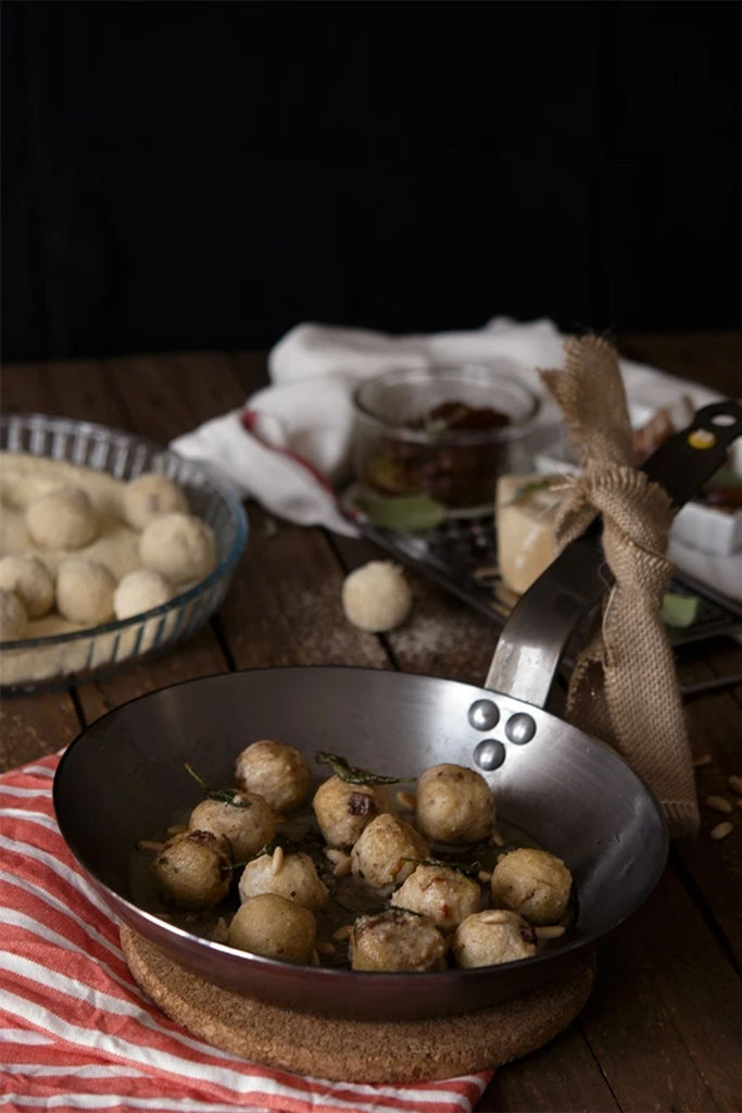 Gnudis de ricota, ajo asado y tomates secos