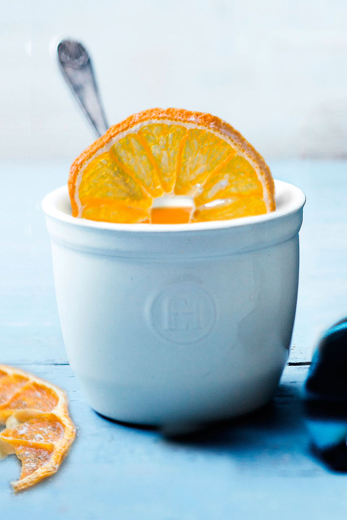 Panna cotta con pera y coulis de naranja