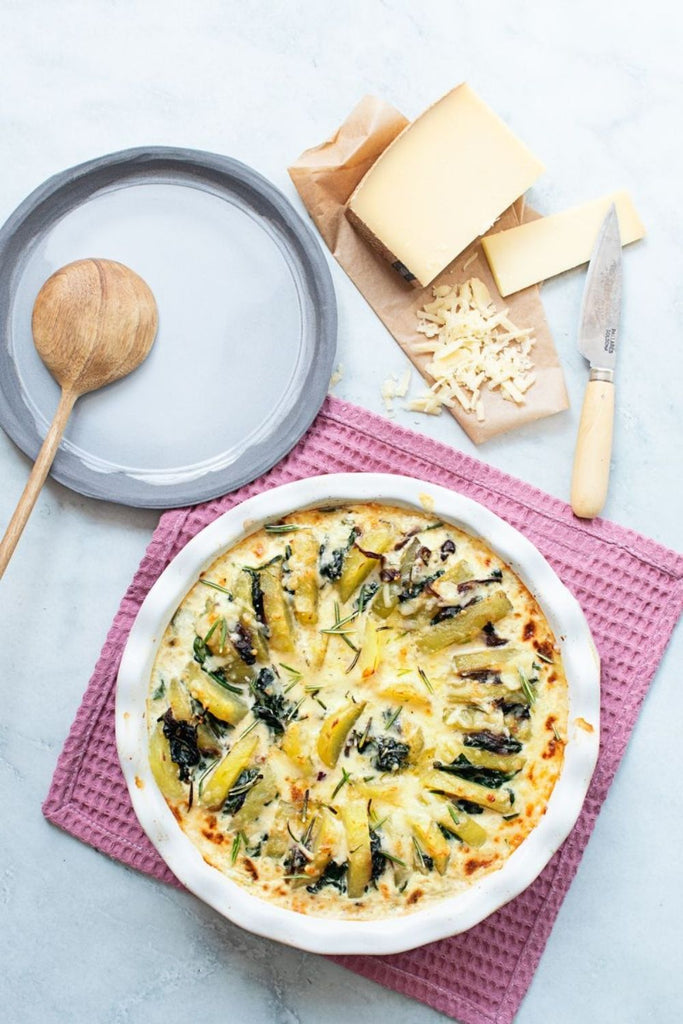 Gratinado de patatas espinacas y gruyère